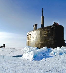 Submarine USS Connecticut surfaces above the ice.